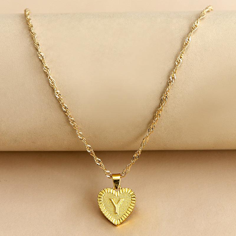 Collar con colgante de corazón con letra inicial